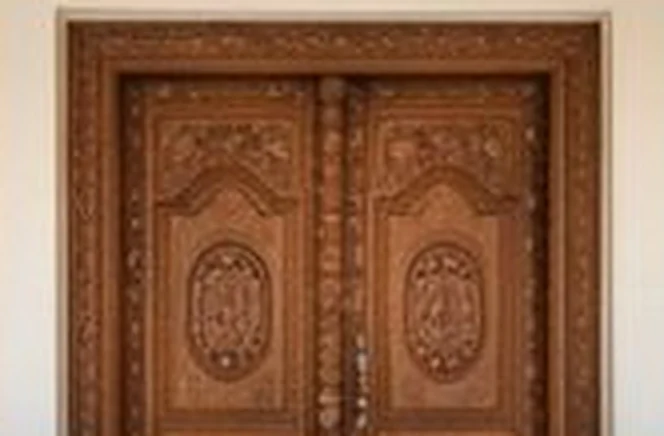 Carved teak double door with medallion panels